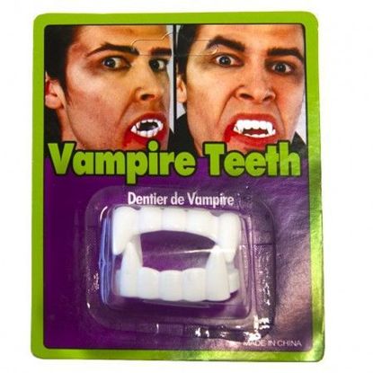 зуби з іклами